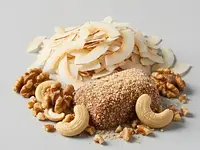 Coconut flakes or chopped nuts for coating (optional)