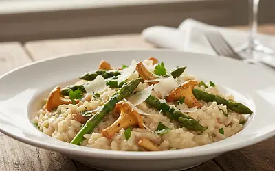 Creamy risotto with chanterelles, asparagus, and parmesan
