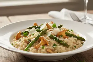 Creamy risotto with chanterelles, asparagus, and parmesan